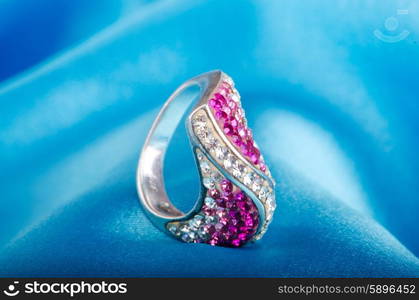 Fashion concept with ring on background