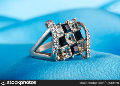 Fashion concept with ring on background