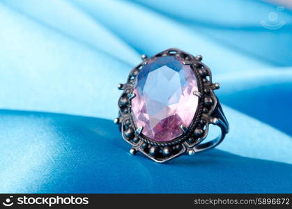 Fashion concept with ring on background