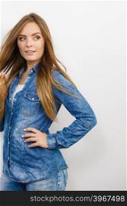 Fashion, denim, people concept. Young girl with denim jacket. Lady is wearing jeans shirt.