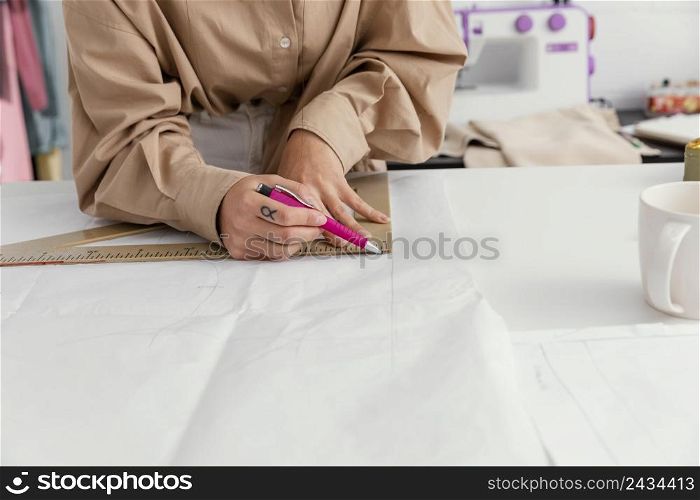 fashion designer working her workshop alone 2