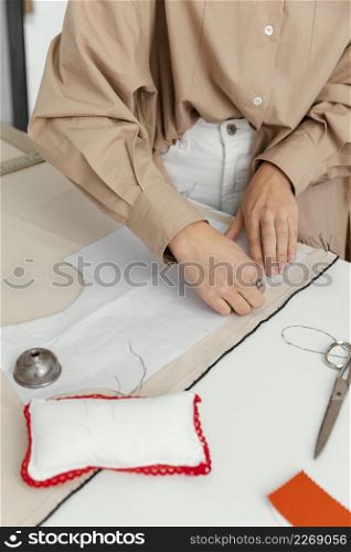 fashion designer working her workshop alone