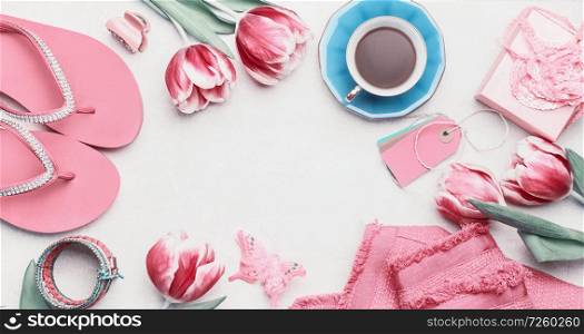 Fashion feminine blogger concept. Set of pink woman accessories on white background. Still life of objects: tulips, cosmetics, jewellery and shoes, top view, flat lay. Copy space for your design