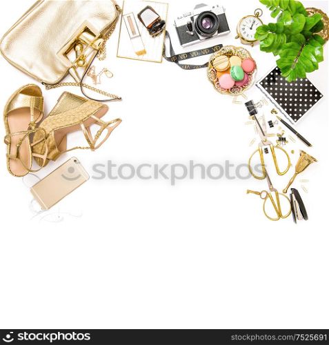 Fashion flat lay. Feminine golden accessories, bag, shoes, office tools, no name photo camera on white background