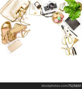 Fashion flat lay. Feminine golden accessories, bag, shoes, office tools, no name photo camera on white background