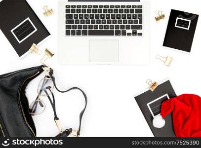 Fashion flat lay for social media. Feminine working place with Christmas decoration on white background