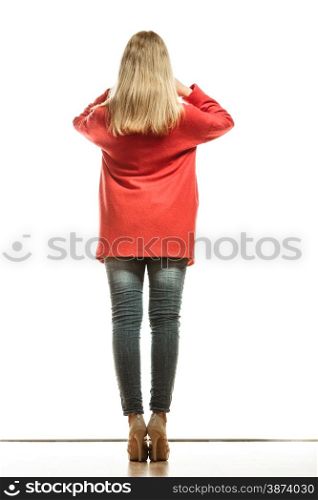 Fashion. Full body blonde fashionable woman in vivid color red coat. Female model rear view isolated on white background