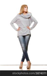 Fashion. Full body blonde fashionable woman jeans pants gray blouse. Female model posing isolated studio shot