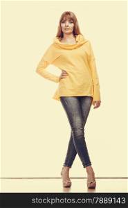 Fashion. Full body fashionable woman jeans pants yellow blouse. Filtered photo