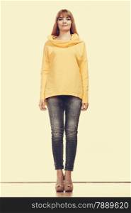 Fashion. Full body fashionable woman jeans pants yellow blouse. Filtered photo
