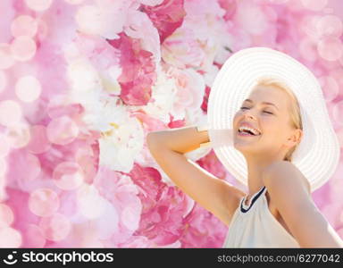 fashion, happiness and lifestyle concept - beautiful woman in hat enjoying summer outdoors