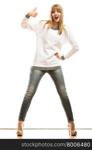 Fashion happiness concept. Full length happy woman jeans pants white long-sleeved shirt making thumb up hand sign gesture isolated