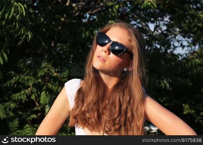 Fashion hipster cool girl in sunglasses.