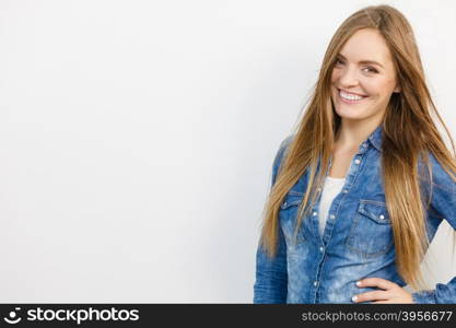 Fashion, jeans, people concept. Lady with beautiful smile. Girl is wearing denim jacket.