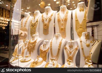 Fashion jewelry from yellow and white gold, on a window shop