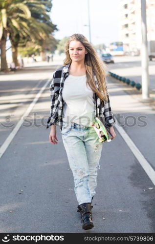 Fashion lifestyle, Beautiful young woman with skateboard