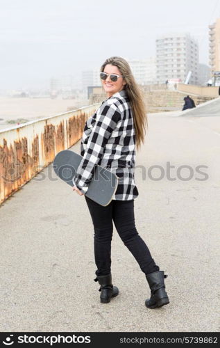 Fashion lifestyle, Beautiful young woman with skateboard