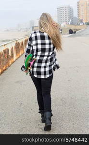 Fashion lifestyle, Beautiful young woman with skateboard