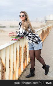 Fashion lifestyle, Beautiful young woman with skateboard