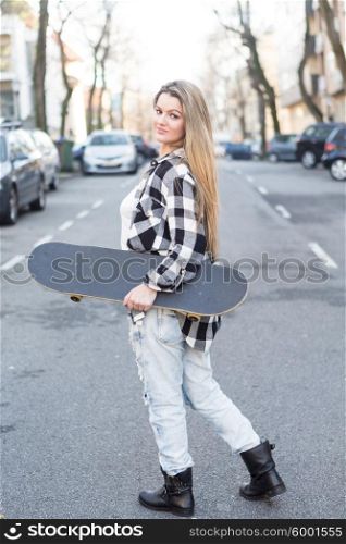 Fashion lifestyle, Beautiful young woman with skateboard