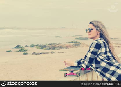 Fashion lifestyle, Beautiful young woman with skateboard