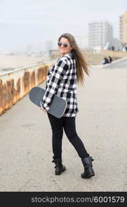 Fashion lifestyle, Beautiful young woman with skateboard