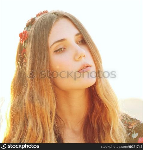 Fashion Lifestyle. Fashion Portrait of Beautiful Young Woman Outdoors. Soft warm vintage color tone. Artsy Bohemian Style.