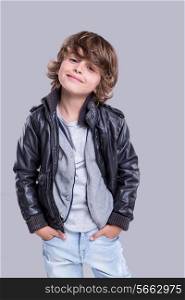 Fashion little boy wearing a leather jacket
