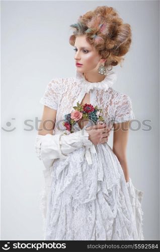 Fashion Model in Flossy White Dress and Wreath of Flowers