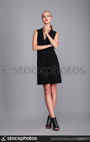 Fashion model in simply black dress.