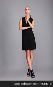 Fashion model in simply black dress.