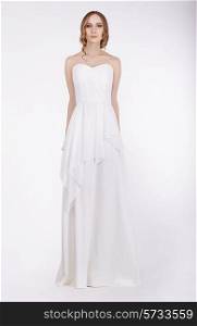 Fashion Model Standing in Long White Dress