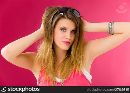 Fashion model - young trendy woman in pink, studio shoot