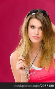 Fashion model - young trendy woman in pink, studio shoot