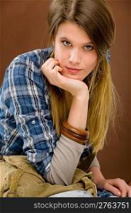 Fashion model - young woman posing in country style clothes