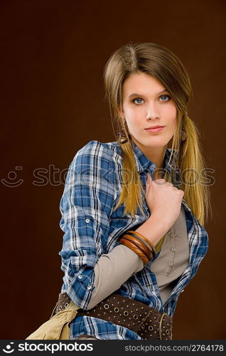 Fashion model - young woman posing in country style clothes