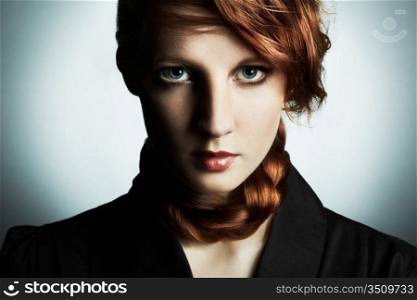 Fashion photo of a beautiful young red-haired woman