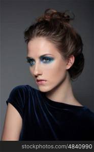 Fashion photo of a young woman. Cosmetic Eyeshadows, eyebrows. Beauty Girl with Perfect Skin.