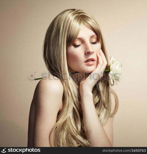 Fashion photo of a young woman with blond hair