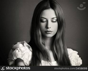 Fashion photo of a young woman with dark hair