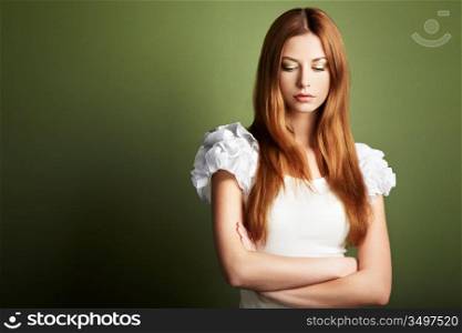 Fashion photo of a young woman with red hair