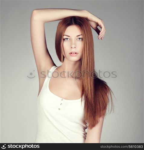Fashion photo of a young woman with red hair. Close-up portrait