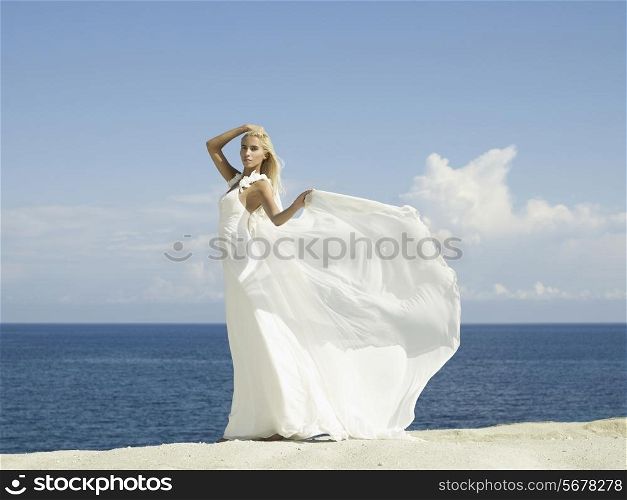 Fashion photo of beautiful elegant bride at the seashore