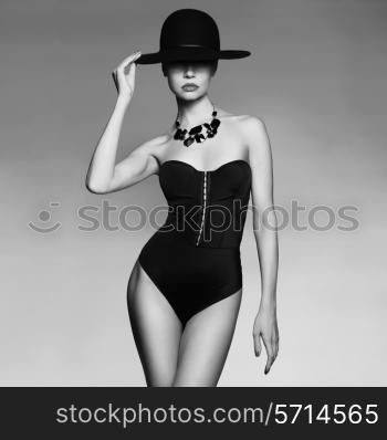 Fashion photo of beautiful lady in elegant black hat
