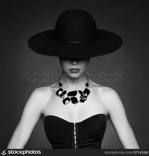 Fashion photo of beautiful lady in elegant black hat