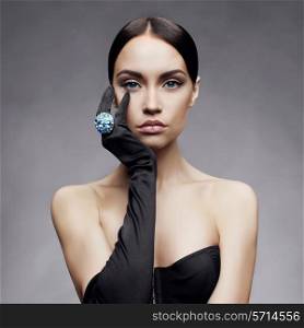 Fashion photo of beautiful lady in gloves with diamond ring