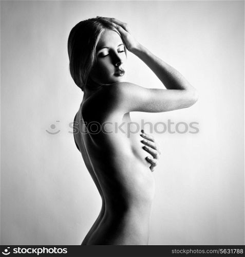 Fashion photo of beautiful nude woman. Black and white photography