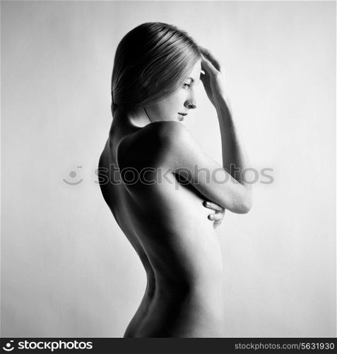 Fashion photo of beautiful nude woman. Black and white photography