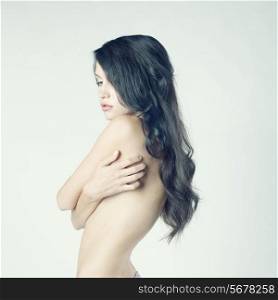 Fashion photo of beautiful nude woman with long dark hair