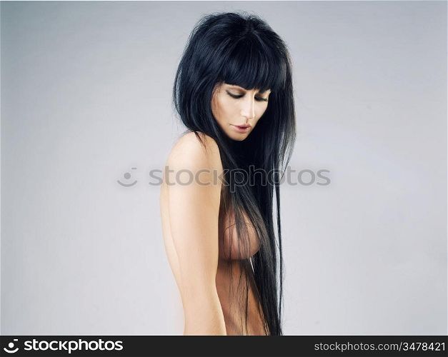 Fashion photo of beautiful nude woman with magnificent hair